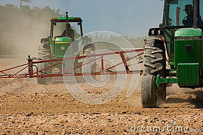 Farmers plowing the field Stock Photo