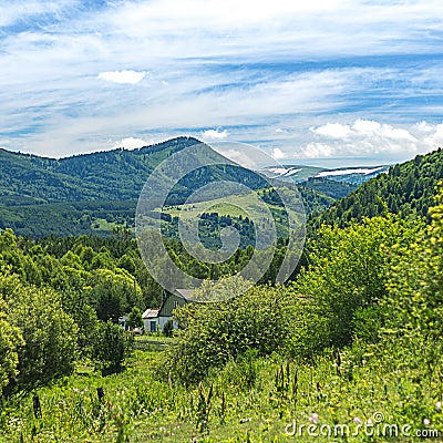 A farmhouse seen behind greenery in Altai Mountains, Kazakhstan Stock Photo