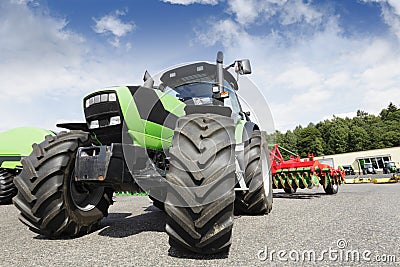 Farming tractor and plough Stock Photo