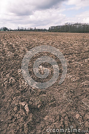 Farmland. Furrows on agricultural land - vintage film look Stock Photo