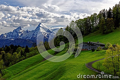 Farmstead in scenic alpine landscape spring season nature Stock Photo