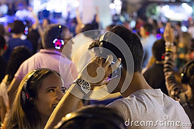 Audience enjoying music in headphones Editorial Stock Photo