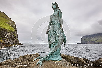 Faroe islands fjord coastline landscape in Kalsoy. Mikladalur mermaid Stock Photo