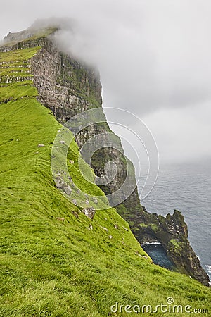 Faroe islands landscape with cliffs and atlantic ocean. Mikladalur, Kalsoy Stock Photo