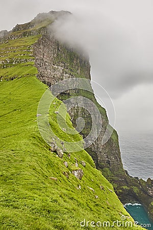 Faroe islands landscape with cliffs and atlantic ocean. Mikladalur, Kalsoy Stock Photo