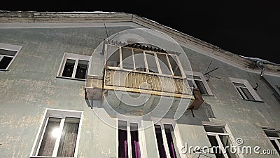 Fasade of house of merchant with balcony at night time Stock Photo