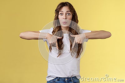 Fascinated impressed charismatic brunette female curly long haircut folding lips whistle astonished react excited Stock Photo