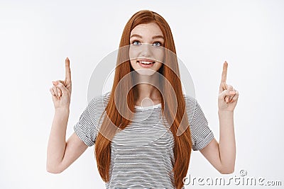 Fascinated impressed redhead good-looking young dreamy girl straight ginger hair widen eyes surprised astonished Stock Photo