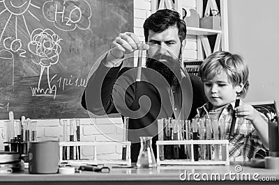 Fascinating chemical reaction. Interesting school classes. School education. School chemistry experiment. Teacher and Stock Photo