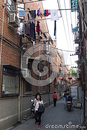 Fascinating streets and trades of Shanghai, China: one of the lanes of the French Concession Editorial Stock Photo