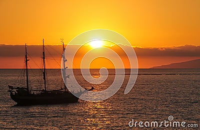 Fascinating sunset and the piracy ship Stock Photo