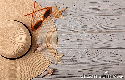 Fashion accessories - hat, glasses orange color on a wooden back Stock Photo