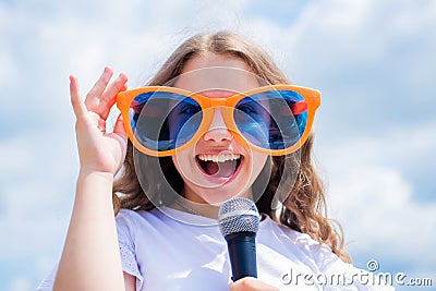 Fashion accessory. Lifestyle and People Concept. make your voice louder. Music and life. teen girl singing song with Stock Photo