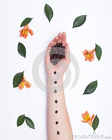 Fashion art hands natural cosmetics girl coffee beans and hibiscus flowers with petals, romantic, fresh Stock Photo