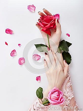 Fashion art portrait woman in summer dress and flowers in her hand with a bright contrasting makeup. Creative beauty photo girls Stock Photo