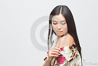 Fashion asian lady in dress in studio Stock Photo