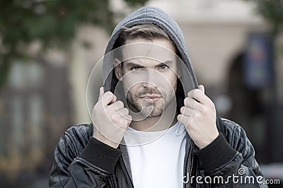 Fashion for autumn chill. Handsome man wear hooded fashion jacket. Young guy in autumn style outdoor. Mens fashion Stock Photo