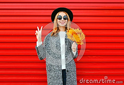 Fashion autumn cool girl with yellow maple leaves Stock Photo