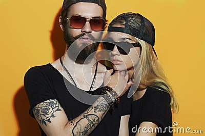 Fashion beautiful couple together. Tattoo Hipster boy and girl Stock Photo