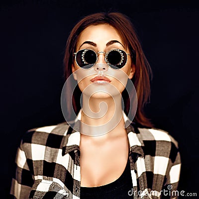 Fashion beauty girl wearing sunglasses, plaid shirt. Stock Photo