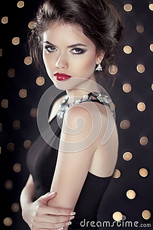 Fashion Beauty Glam Brunette Girl Model over bokeh lights background Stock Photo