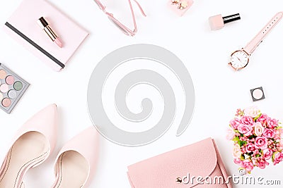 Fashion blogger workspace flat lay with pumps, cosmetics, purse, planner book and flowers. Stock Photo