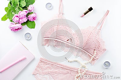 Woman elegant pink lace bra and panties, pumps and jewelry. Stylish lingerie flat lay. Stock Photo