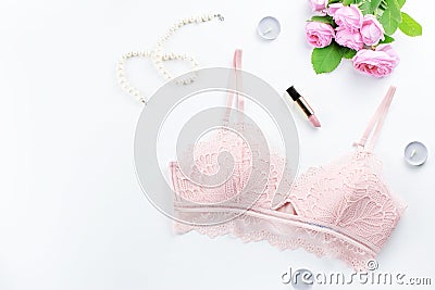 Woman elegant pink lace bra and panties, pumps and jewelry. Stylish lingerie flat lay. Stock Photo