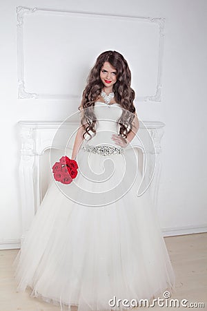 Fashion brunette bride in wedding dress posing over modern deco Stock Photo