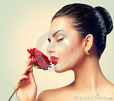 Fashion brunette model girl with red rose Stock Photo