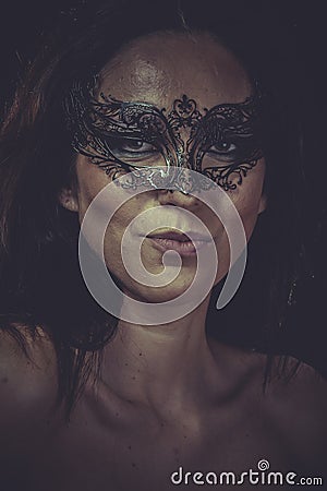 Fashion brunette woman in black mask metal frills Stock Photo