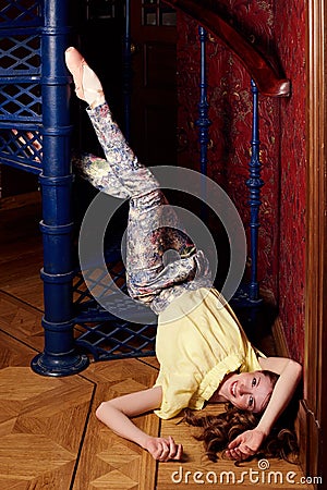 Fashion caucasian ballerina in costume at spiral staircase Stock Photo