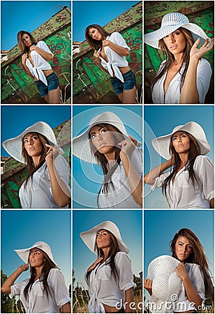 Fashion caucasian model posing outdoor in front of an old boat. brunette with white shirt and denim shorts Stock Photo