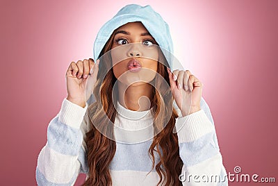 Fashion, comic face and portrait of woman on studio background for funny face, kiss and emoji reaction. Beauty, facial Stock Photo