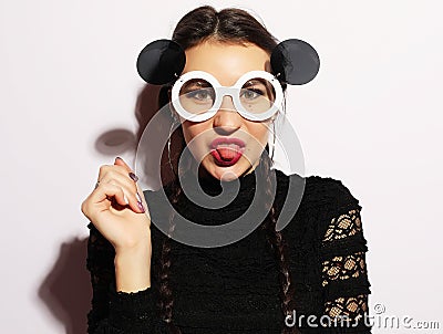 Fashion concept. Beauty surprised fashion model girl wearing big sunglasses. Young girl. Makeup. Stock Photo