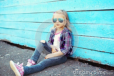 Fashion cool child wearing a sunglasses and checkered shirt Stock Photo