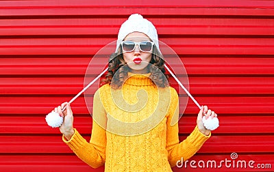 Fashion cool girl blowing red lips makes air kiss Stock Photo