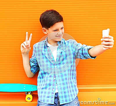 Fashion cool teenager boy is taking picture self portrait Stock Photo
