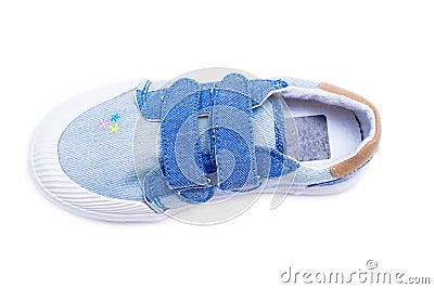 Fashion denim baby shoes for the toddlers feet. Kids sneakers isolated on white background. Stock Photo