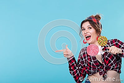 Fashion, desert, people concept - pin-up woman with lollipops copy spaces show the left Stock Photo