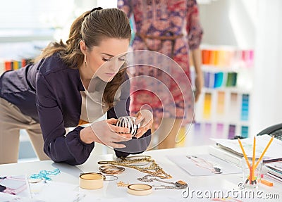 Fashion designer choosing accessories Stock Photo