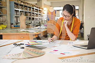 Fashion designer drawing design sketch Stock Photo