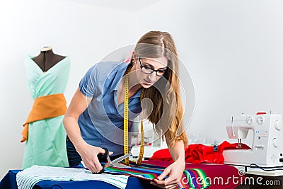 Fashion designer or tailor working in studio Stock Photo