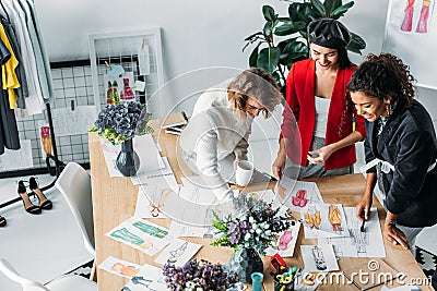 Fashion designers working with sketches Stock Photo