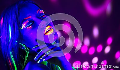 Fashion disco woman. Dancing model in neon light, portrait of beauty girl with fluorescent makeup Stock Photo