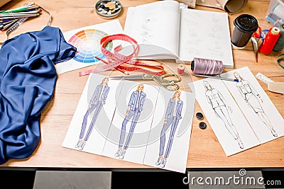 Fashion drawings with tailoring tools Stock Photo