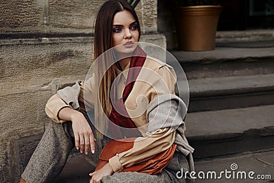 Fashion Female Model In Fashionable Clothes Posing In Street Stock Photo