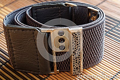 Fashion gray Belt on wooden background. Stock Photo