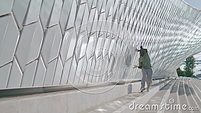 Fashion guy dancing wall alone. Brown skin man showing contemporary performance Stock Photo