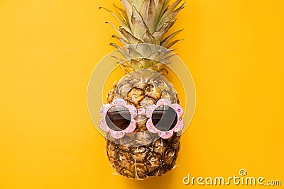 Fashion Hipster Pineapple in Sunglasses. Bright Summer Color. Tropical Fruit. Creative Art concept. Minimal style Hot Beach Party Stock Photo